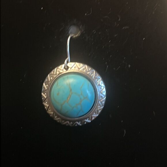 Handcrafted silver tone earrings with an turquoise colored stone. - Picture 2 of 4